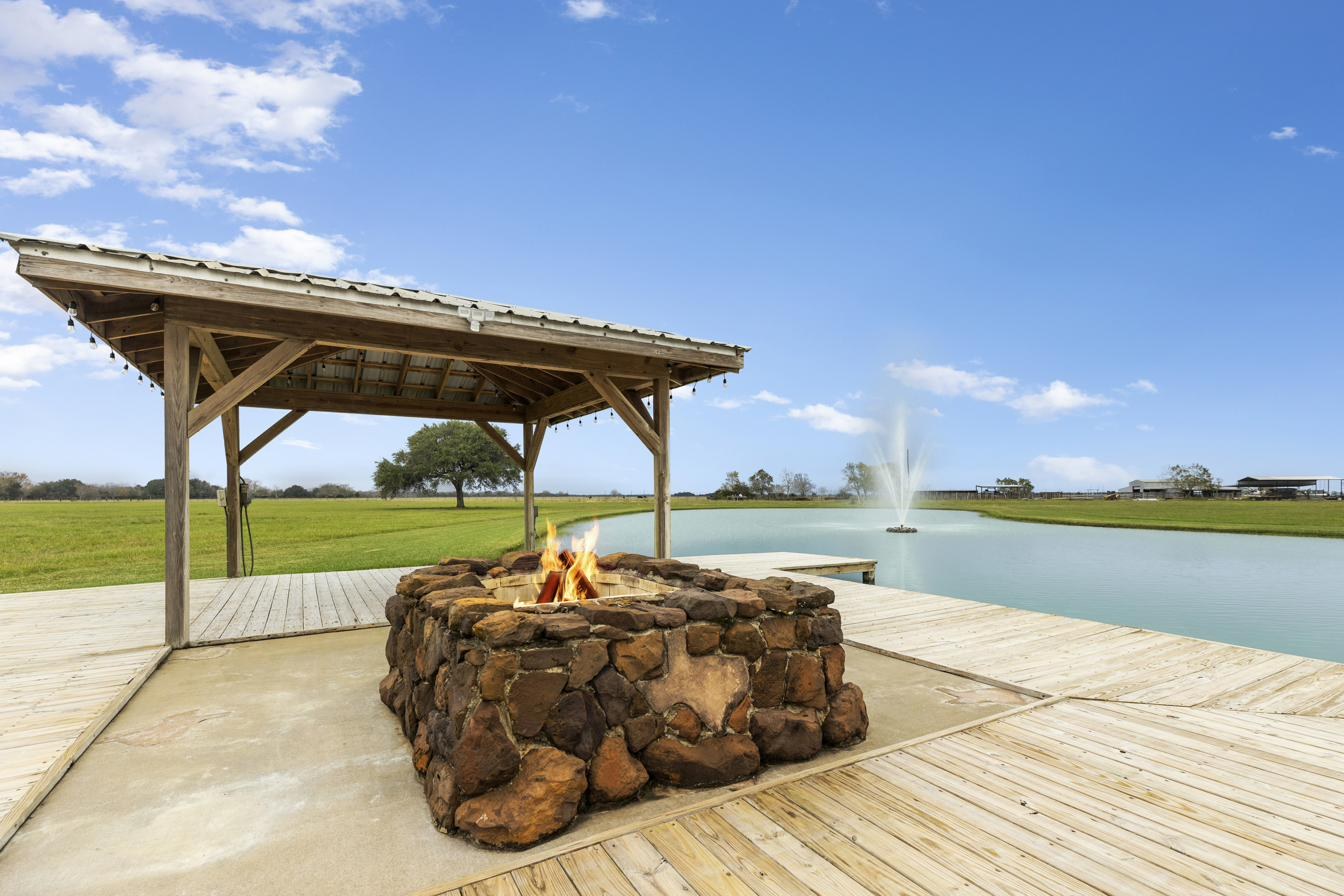 Stone fire pit on the deck by the lake
