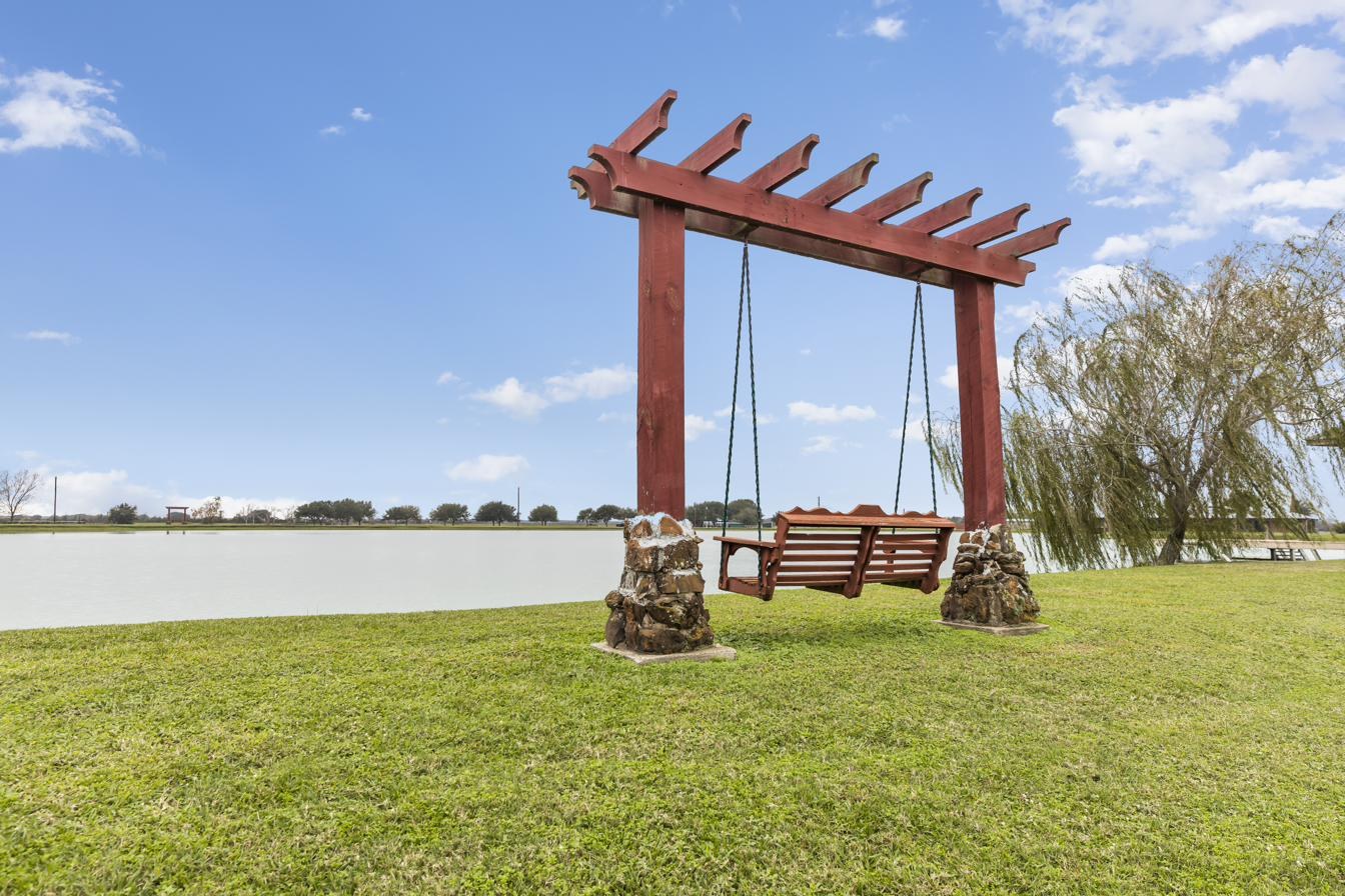 Porch swing by the water