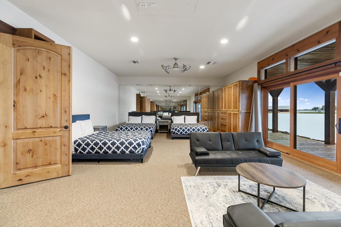 Lodge bedroom with rows of queen beds