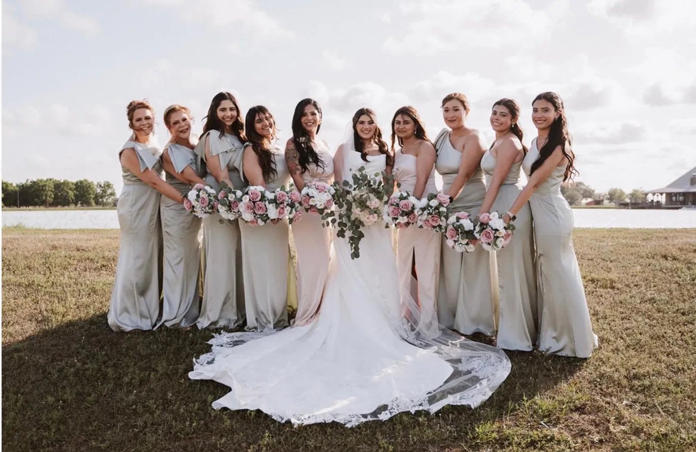 Bride and bridesmaids by the lake